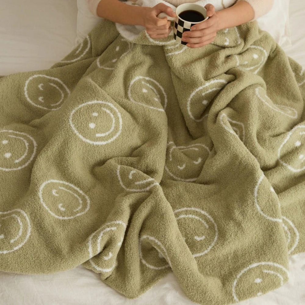 Smiley Face Plush Blanket — product in use