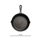 Black Cast Iron Frying Pan — material texture close-up