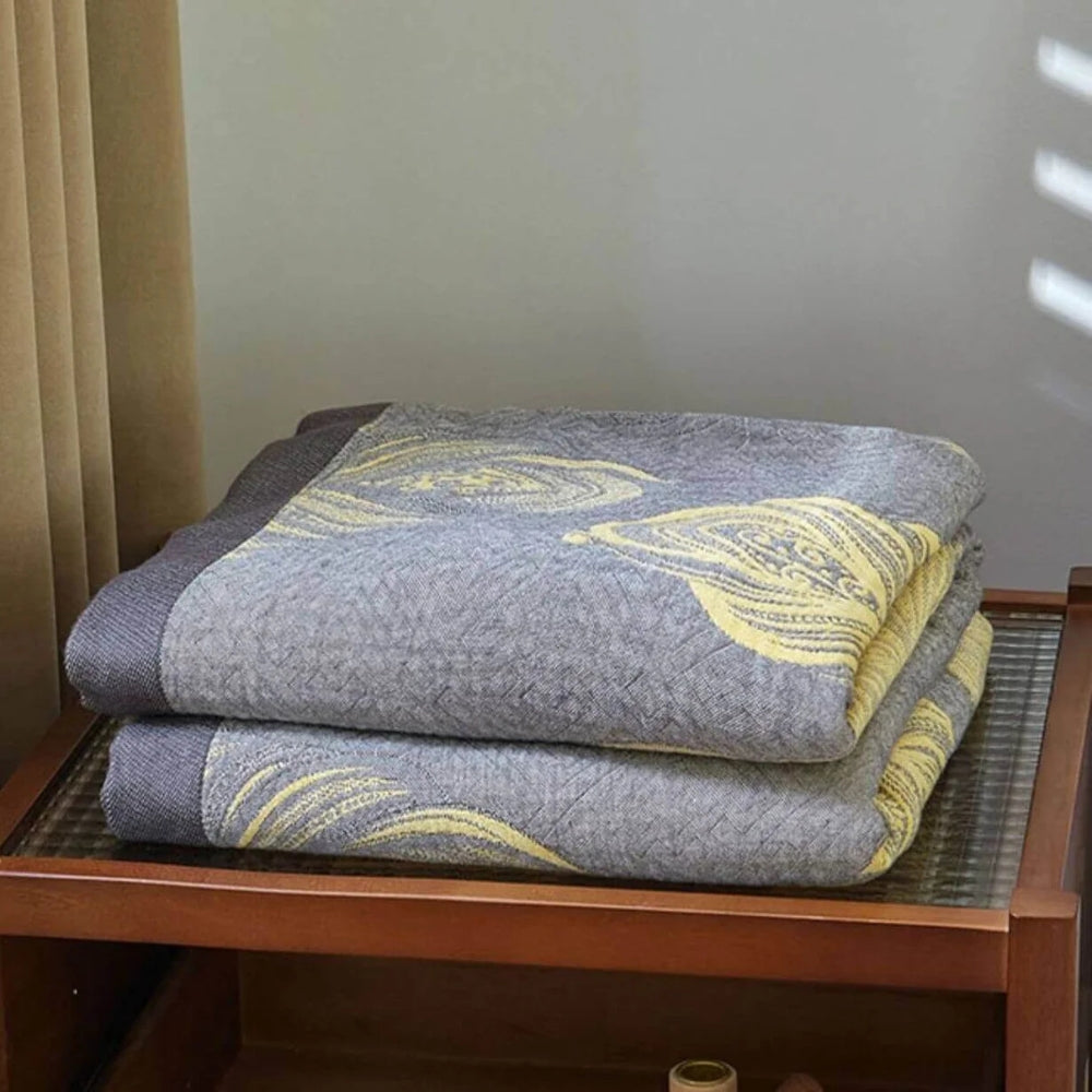 Feather Print Bamboo Fibre Reversible Blanket — lifestyle shot
