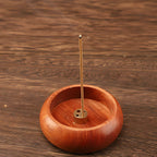 Round Solid Wood Incense Stick Holder — lifestyle shot